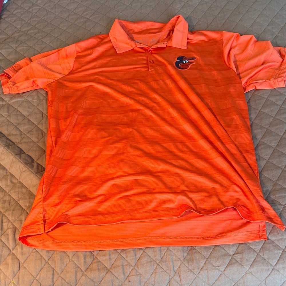 Antigua Orioles Orange Polo Shirt with embroidered logo.